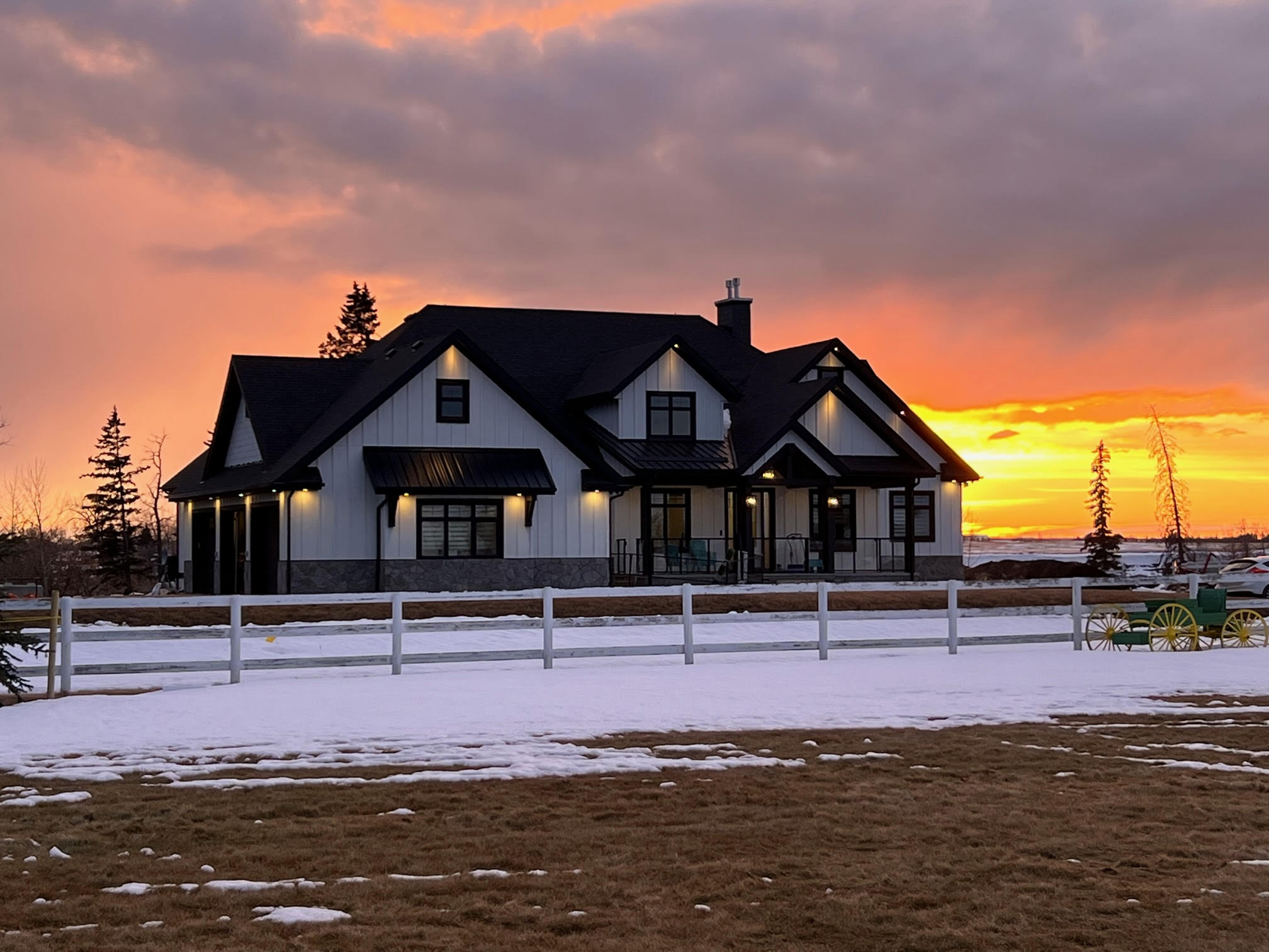 A modern, two-story house with black and white exterior, full ICF basement includes a wine cellar and cold storage room.